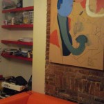 note on photo in asmysunrise's flickr stream reads, "matches the couch, fits perfectly on the exposed brick protrusion. oh bear stearns, it was fate that brought us together (also interesting that it came to me in austin shortly before moving to NYC, when i had no idea i'd ever end up there)." 6/09